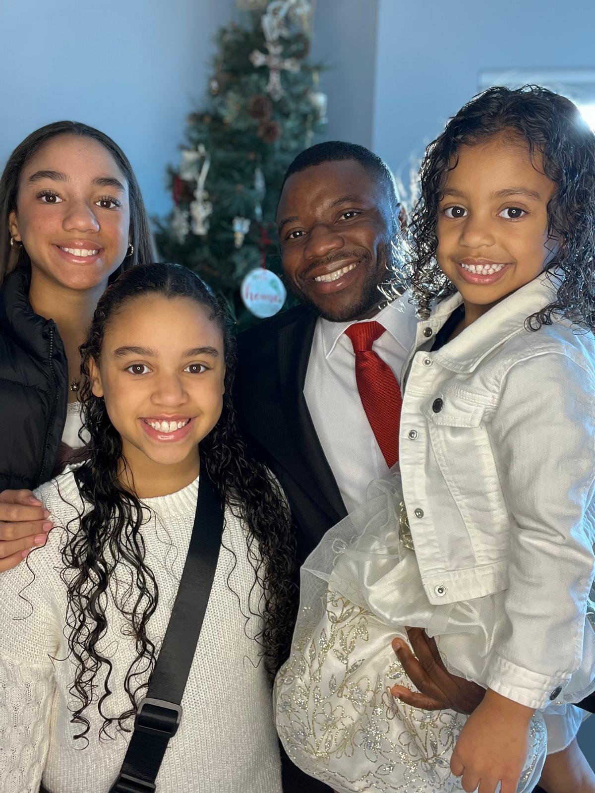 Gospel Kordah, founder of Future1 Community, with his family